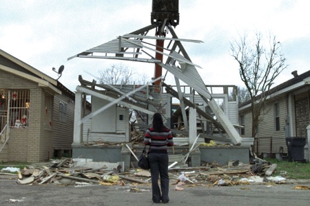 Woman looking at devastated New Orleans house (Treme)