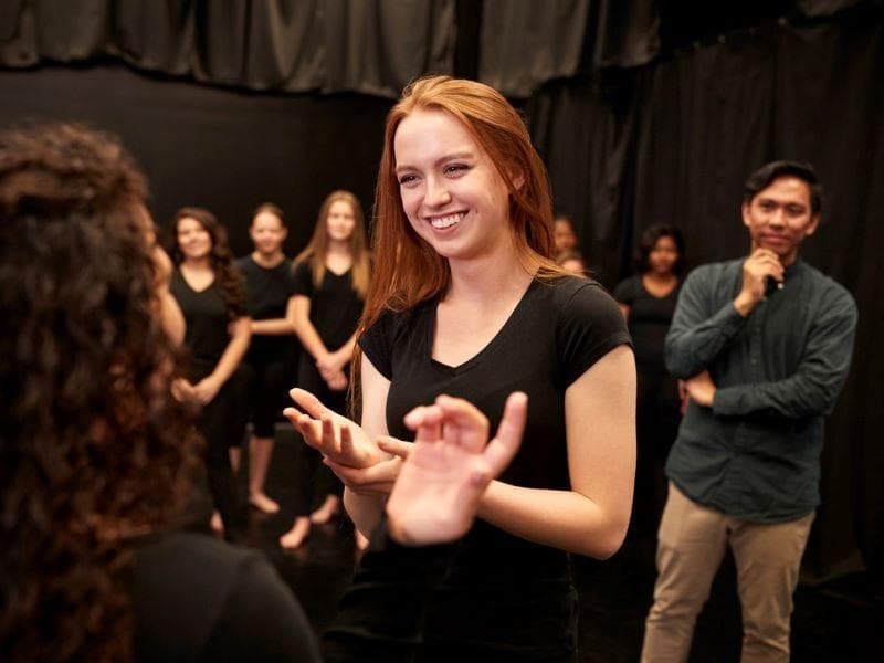 Students performing drama activities