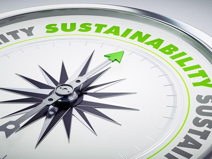 Compass pointing to sustainability