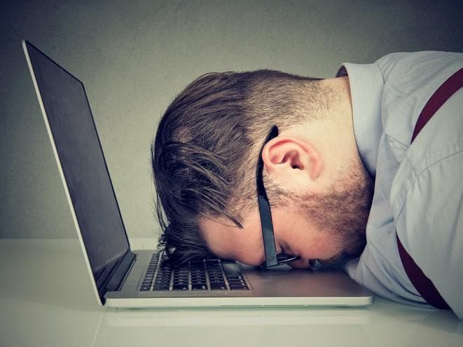 A student asleep on his laptop. Just because someone has logged into a class does not mean they have engaged with that class.