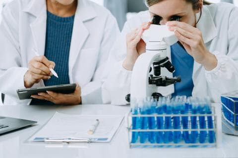Medical researchers in white lab coats
