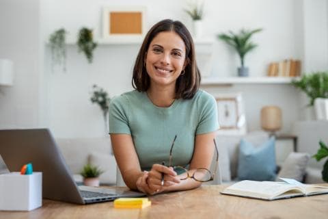 Business woman on her laptop in her living room