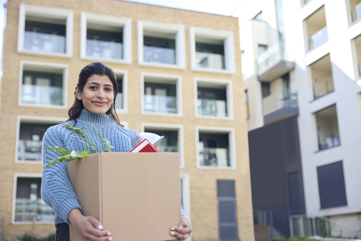 Student carrying box arrives at university