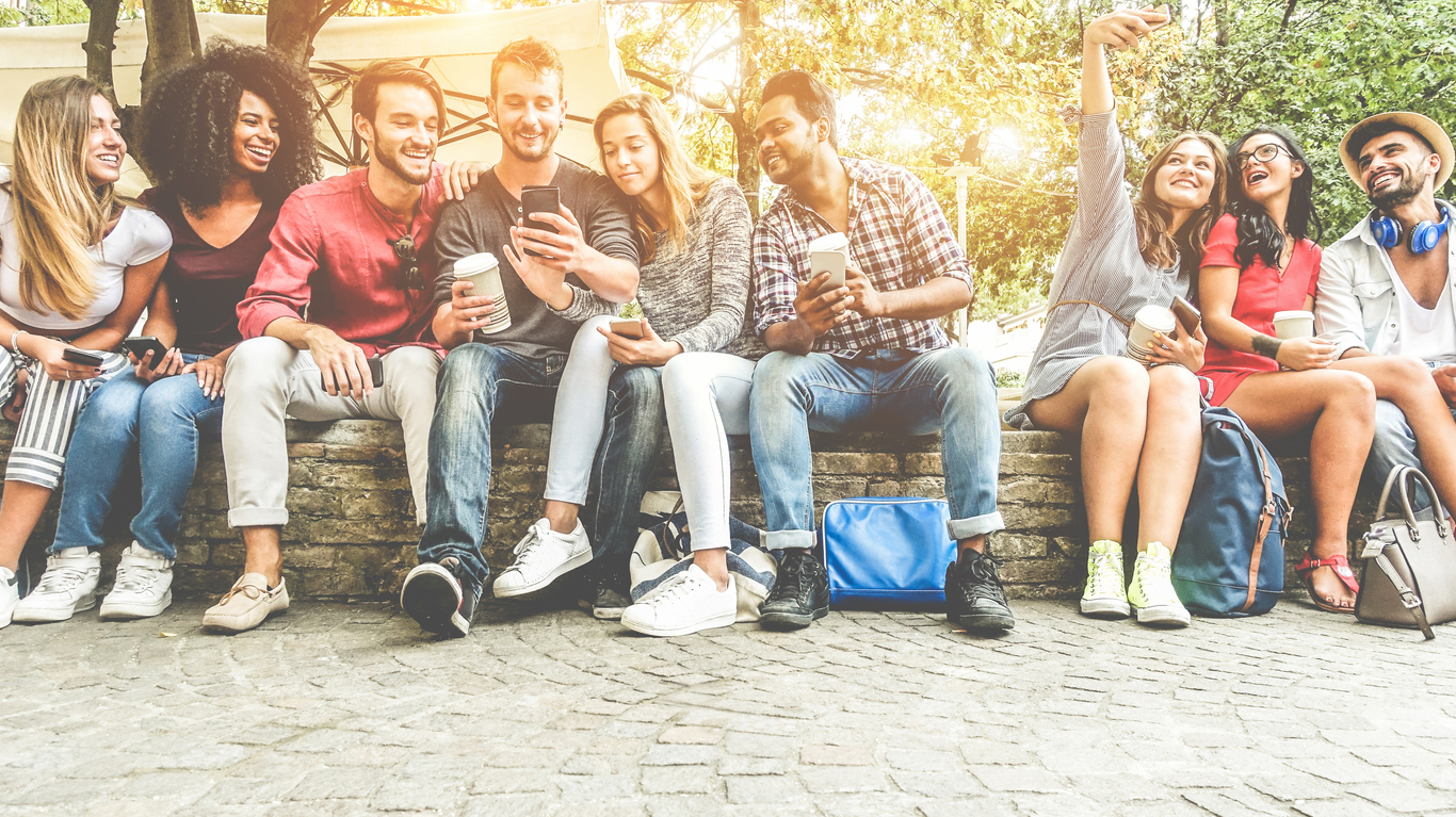 A group of students, sitting in the Australian sunshine