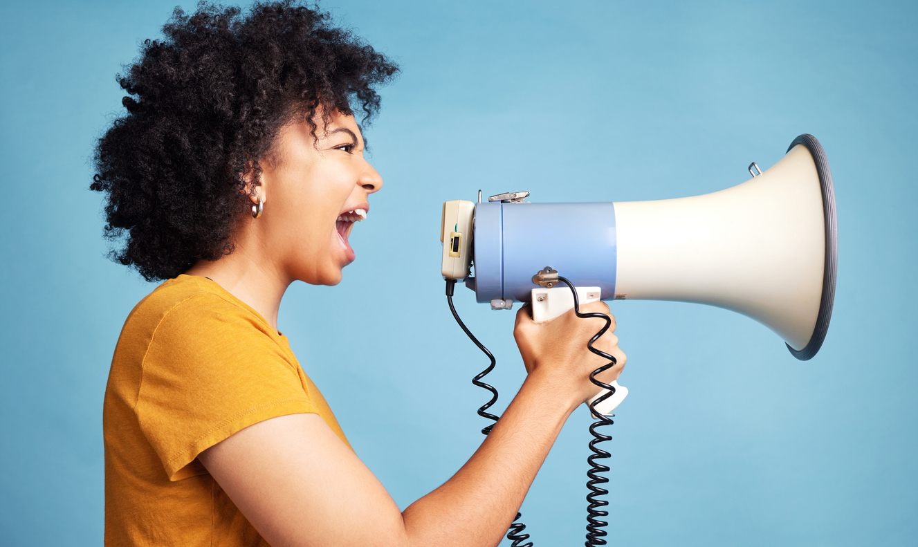 Woman shouting into megaphone