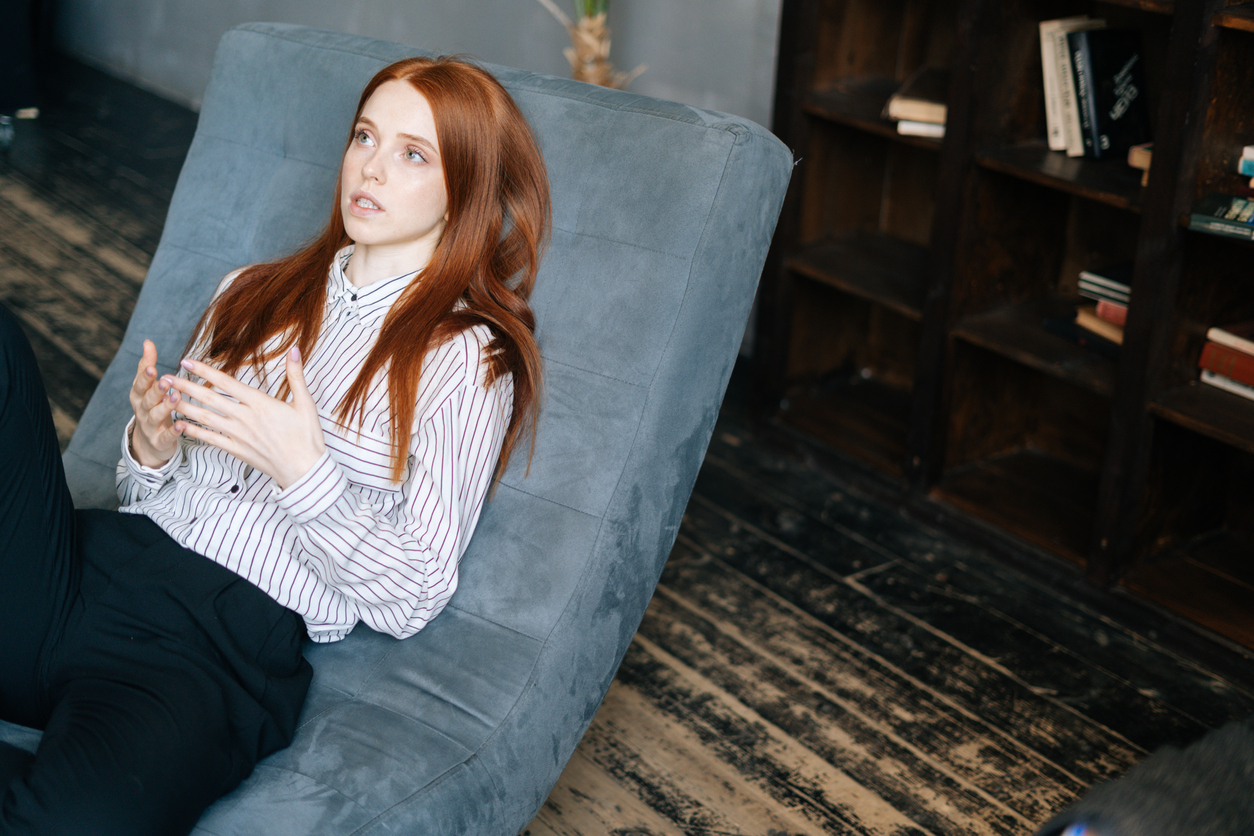 Young woman on psychotherapist's couch