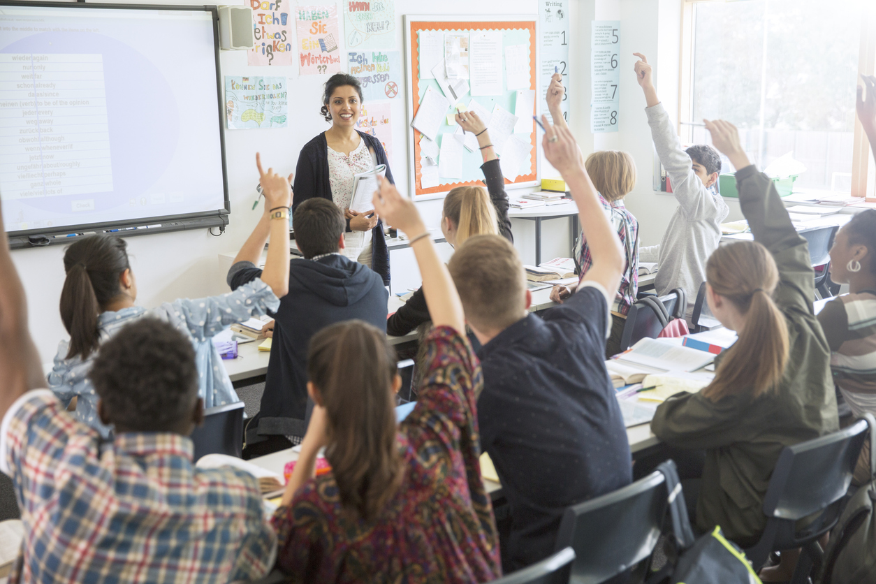 Teacher in a classroom with teenage students