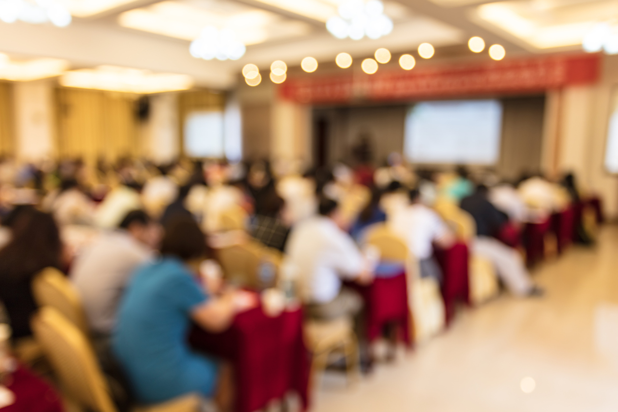 Artistically blurred image of people in a conference room