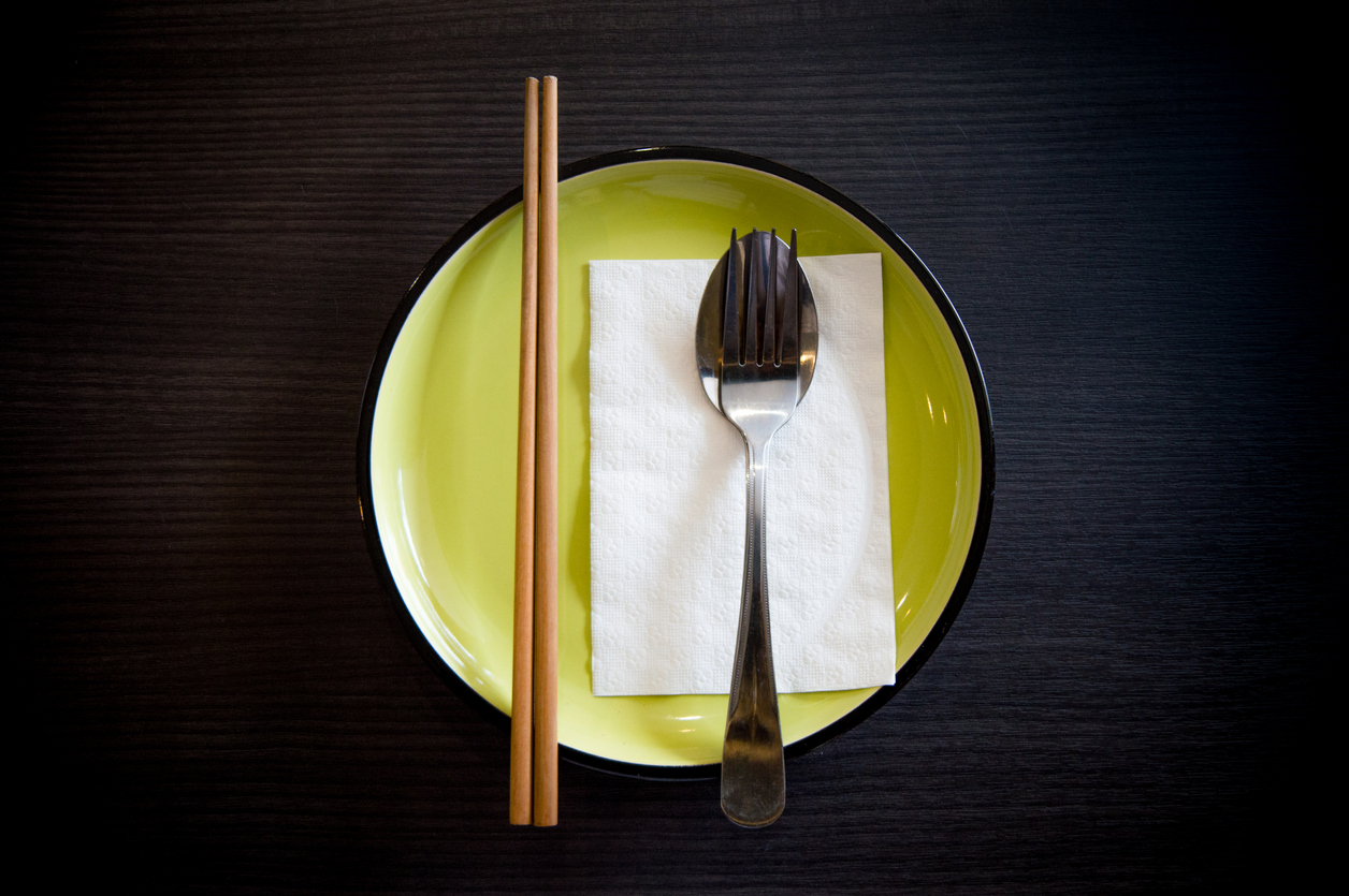 Table set with chopsticks, knife and fork