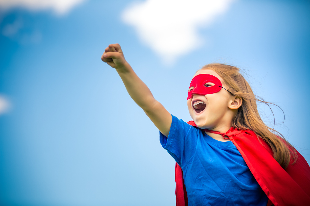 Small child dressed as superhero