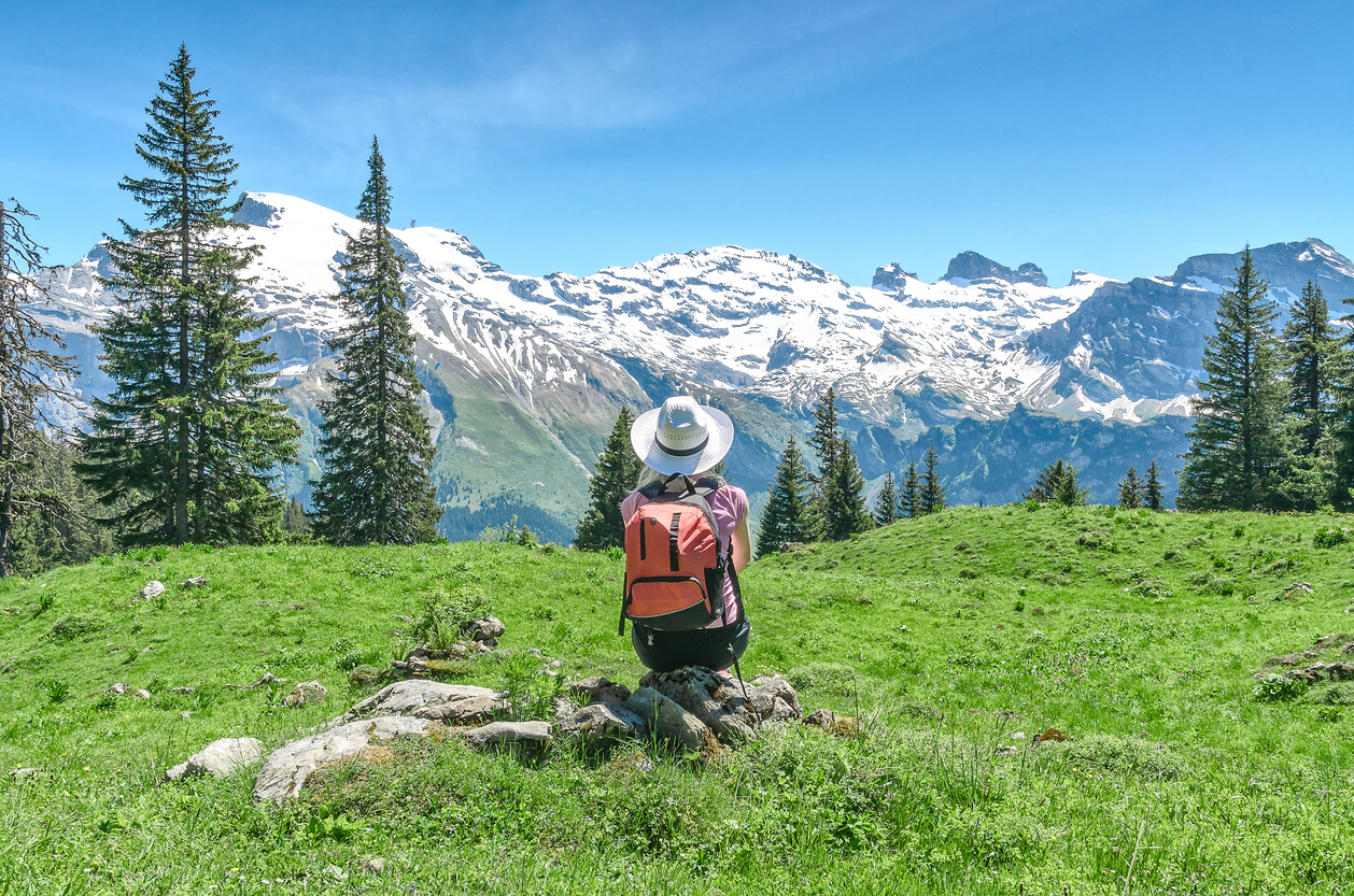 Student looking out at the Swiss Alps