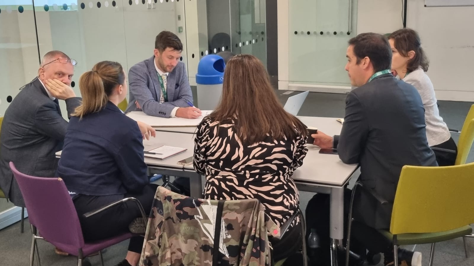 Group of people working around a table