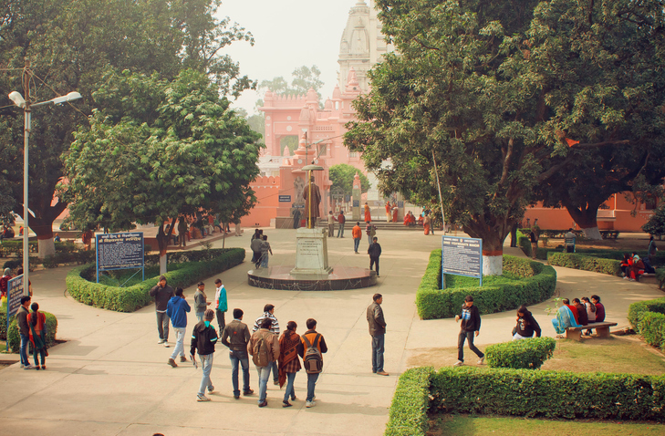 Students walk through the ground of Banaras Hindu University, in India