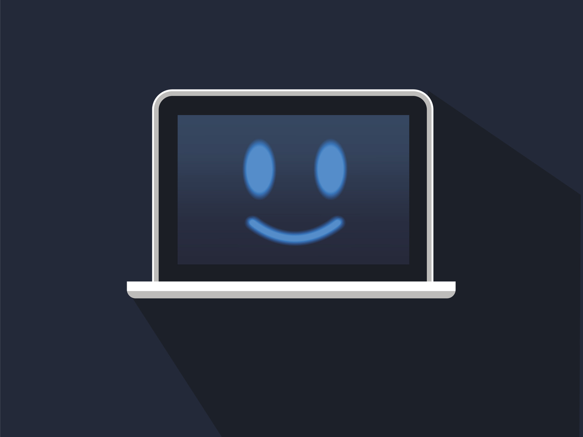 Laptop with smiling face on screen