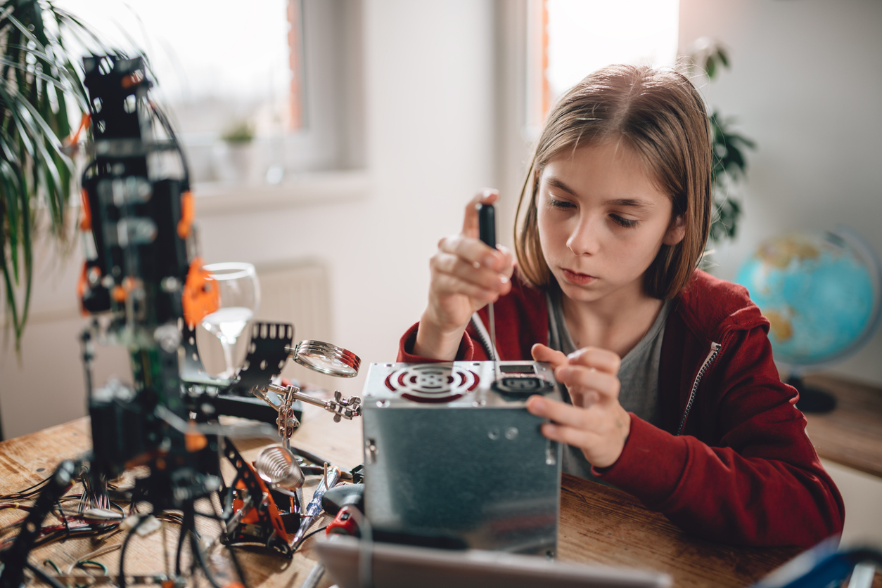 Teenager building a robot at home