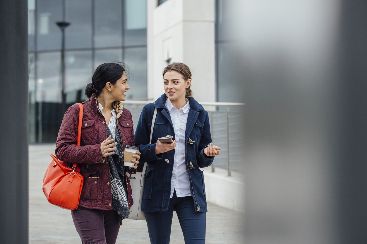 Student and counsellor walking and talking