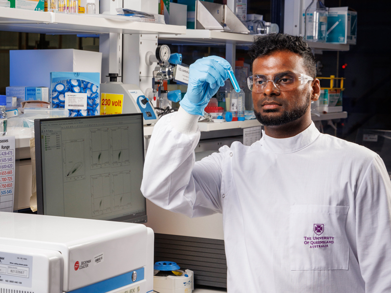 A University of Queensland radiopharmaceutical researcher in a laboratory