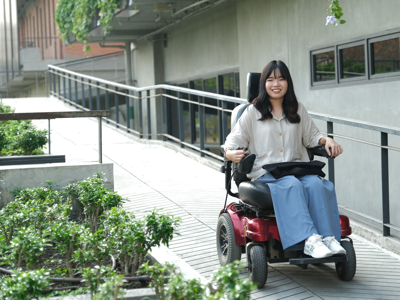 Person using a wheelchair smiling