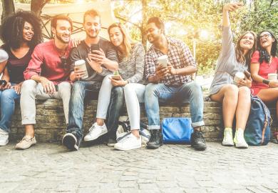 A group of students, sitting in the Australian sunshine