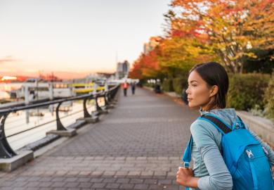 Student walking along Vancouver harbour area