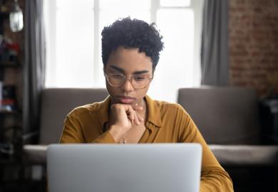 Student at computer, concentrating