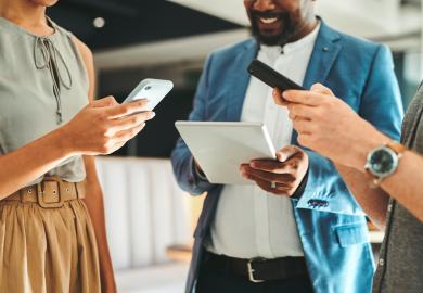 A group of people, sharing information via mobile devices