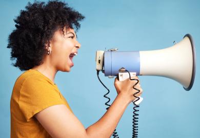 Woman shouting into megaphone