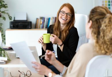 Parent and school counsellor chatting happily