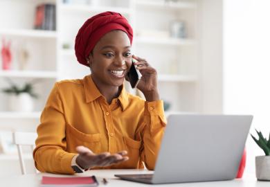 Woman in office, talking on phone