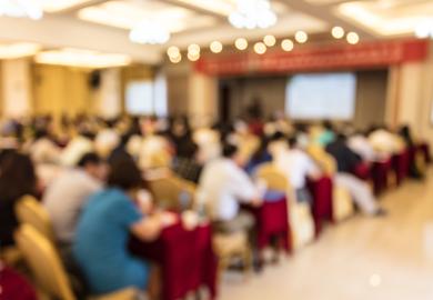 Artistically blurred image of people in a conference room