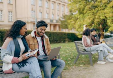 Students on bench outside university in Czechia