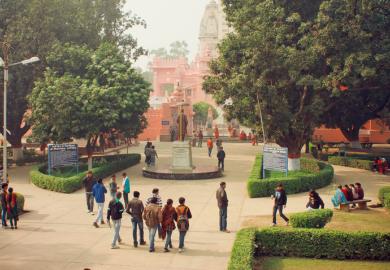 Students walk through the ground of Banaras Hindu University, in India