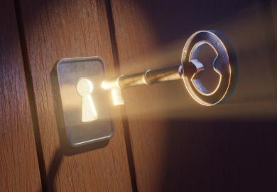 Light shining through keyhole, as key is inserted