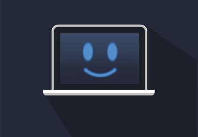 Laptop with smiling face on screen