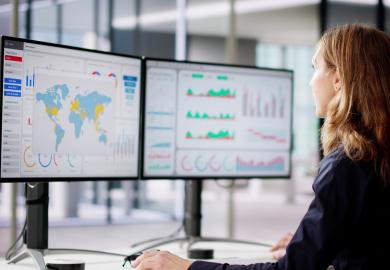 Woman looking at data on computer 