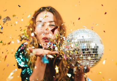 Woman with disco ball and confetti