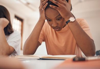 Student working hard for difficult exam