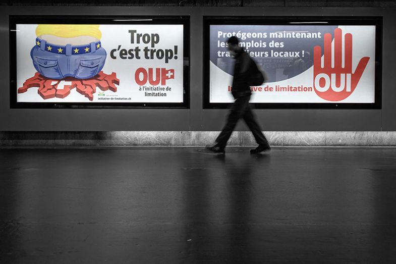 right-wing Swiss Peoples Party (SVP) posters that state that translates from German as "Too much is too much!" (L) and "Protecting the jobs of local workers now". Objecting to a freedom of movement agreement with the EU, 2020.