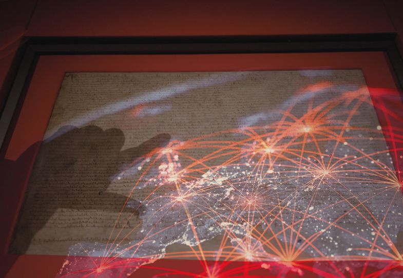 A montage of the Magna Carta with a shadowed hand pointing, set against a backdrop of stars