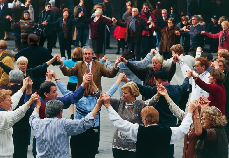 Men and women dancing the Sardana, Catalan folk dance to illustrate Good things come to good academic citizens