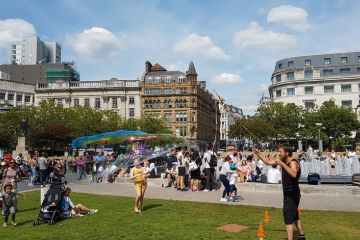 A young man blows soap bubbles at the Piccadilly Gardens in Manchester city centre