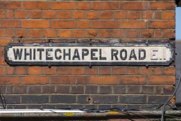 An old street sign on the Whitechapel Road in the East End of London, UK.