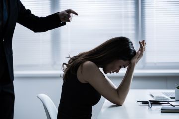 A boss bullies a female employee
