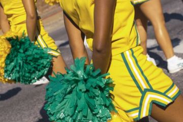 Cheerleaders marching in a parade in New Orleans, United States of America.