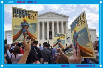 People holding placards stating "Diversity is Strength" outside the US Supreme Court, Washington DC