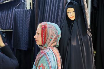 A woman in Tehran wearing a hijab