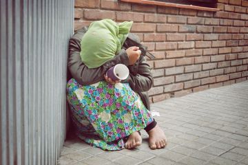 Homeless woman begging