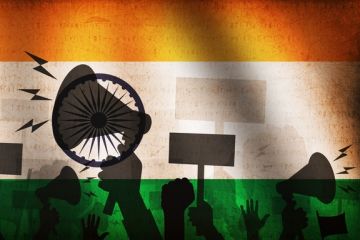 Megaphones superimposed on an Indian flag, illustrating academic freedom