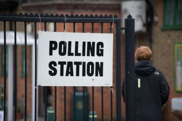 Someone walks into a polling station 