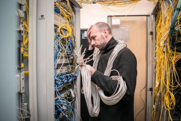 A computer technician gets lost in wires and wishes he had kept things simple.